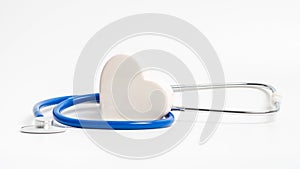 White heart and blue stethoscope on white background. Concept of heart check or cardiology treatment of cardiovascular