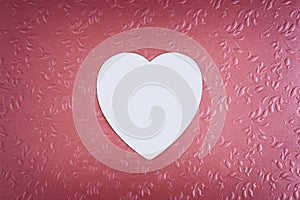 White heart on pastel textured pink background