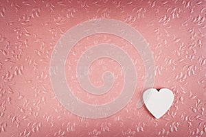 White heart on pastel textured pink background