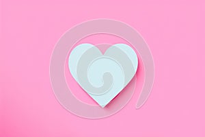 White heart on pink background. Concept of love and simplicity.