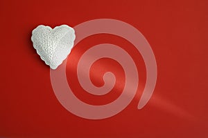 White heart on red background. Valentine`s day, anniversary, mother`s day, marriage concept, invitation e-card