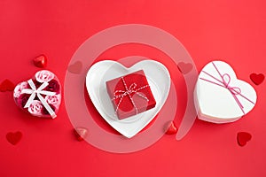 White heart-shaped plate and Different Gift boxes.