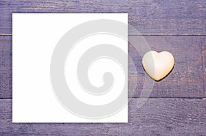White heart on the wooden background