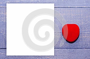 White heart on the wooden background