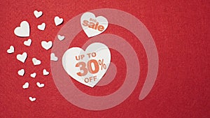 White hearts for big sale on red background