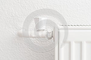 White heating radiator in an apartment. Detail shot