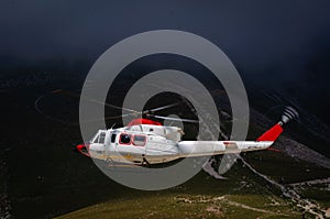 A white helicopter in flight