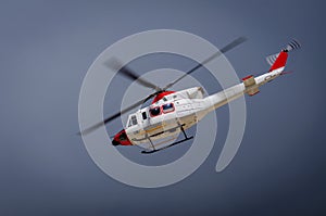 A white helicopter in flight