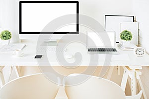 White hipster desktop with computer and laptop