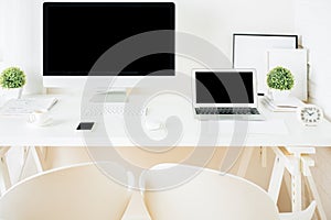 White hipster desktop with pc and notebook