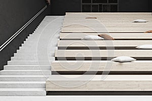 White home movie theater with comfortable pillows on stairs seats, wooden details and concrete walls. Seminar concept. 3D
