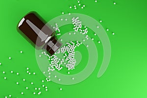 White homeopathy globule with bottle over green background with copy space, homeopathy medicine concept, flat lay from above