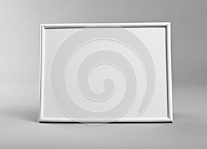 White horizontal frame for paintings or photographs on gray back