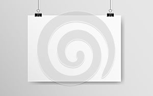 White horizontal poster mockup. Empty A4 paper hanging on a wall. Light blank on a rope. Realistic template with soft photo