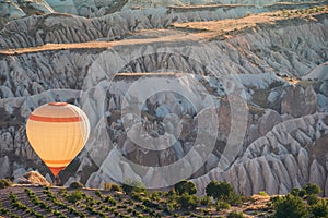 White hot air balloon with rising over the Cappadocian valley