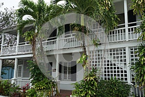 White house with balcony and veranda built in typical colonial style in Nassau, Bahamas.