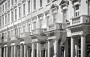 White house fronts with columns and balconies