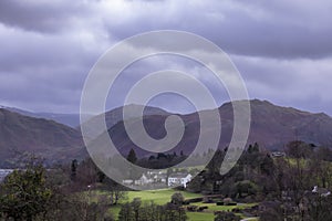 White house in a green field at Ullswater lake