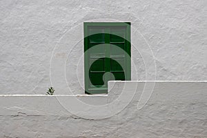 White house with green shutter window, Spain