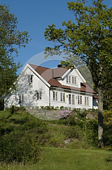 White house in lush garden