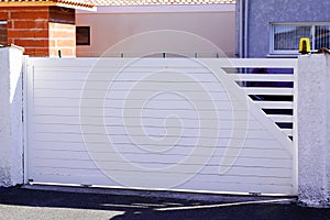 White house steel sliding door aluminum gate at modern home entrance