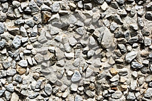 White house wall made of concrete panels consisting of small stones