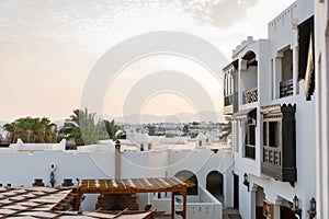 White houses in Ð°rabic style with wooden balconies, background