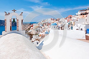 White houses and traditional church in Oia village, Santorini, Greece