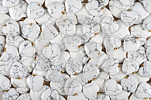 White howlite heart-shaped stones pile