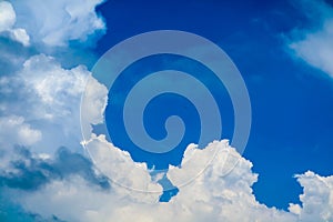 white huge cloud in summer clear blue sky over the ocean