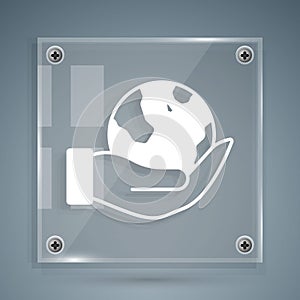 White Human hand holding Earth globe icon isolated on grey background. Save earth concept. Square glass panels. Vector