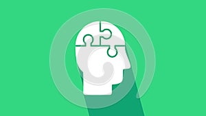 White Human head puzzles strategy icon isolated on green background. Thinking brain sign. Symbol work of brain. 4K Video
