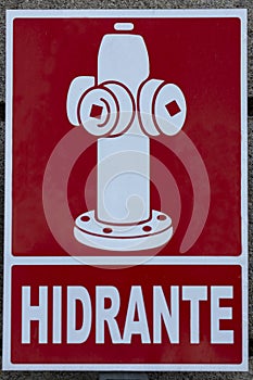 White hydrant sign on a red background. photo