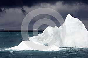 White Iceberg Under Stormy Sky