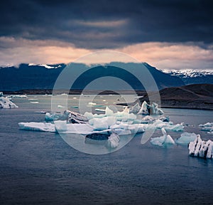 White icebergs floating in popular tourist destination - Jokulsarlon glacial lagoon