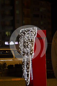 White illuminated new year decoration on red background