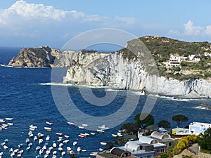 White imposing cliffs in a bay of Ponza in Italy.