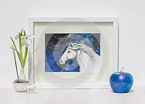 White interior display. Framed horses head painting, blue background. photo