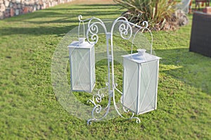 White iron decor lanterns in the house garden grass lawn