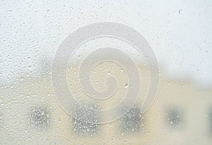 White isolated background water drops on glass wet window with splashes, texture autumn background