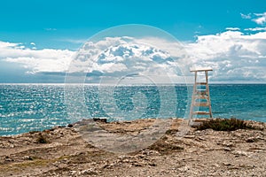 White isolated safeguard on an empty virgin beach is South of Spain.