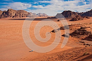 White jeep in a Wadi Rum desert,