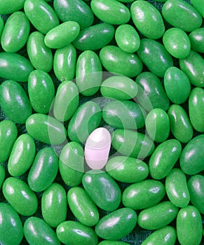 White jelly bean in green ones