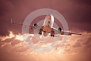 White jet in cloudy sky