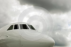 White Jet Cockpit and storm clouds