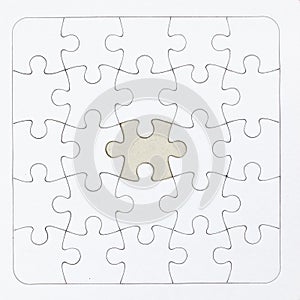 White jigsaw puzzle with a missing piece