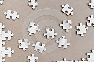 White jigsaw puzzles, on cardboard