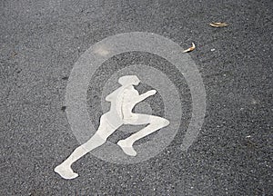 The white jogging man painting on the jogging lane. run at a steady gentle pace.