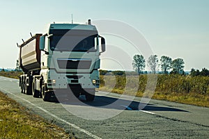 White Kamaz on the road.