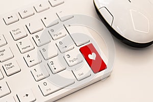 White keyboard with heart sign. Internet dating concept